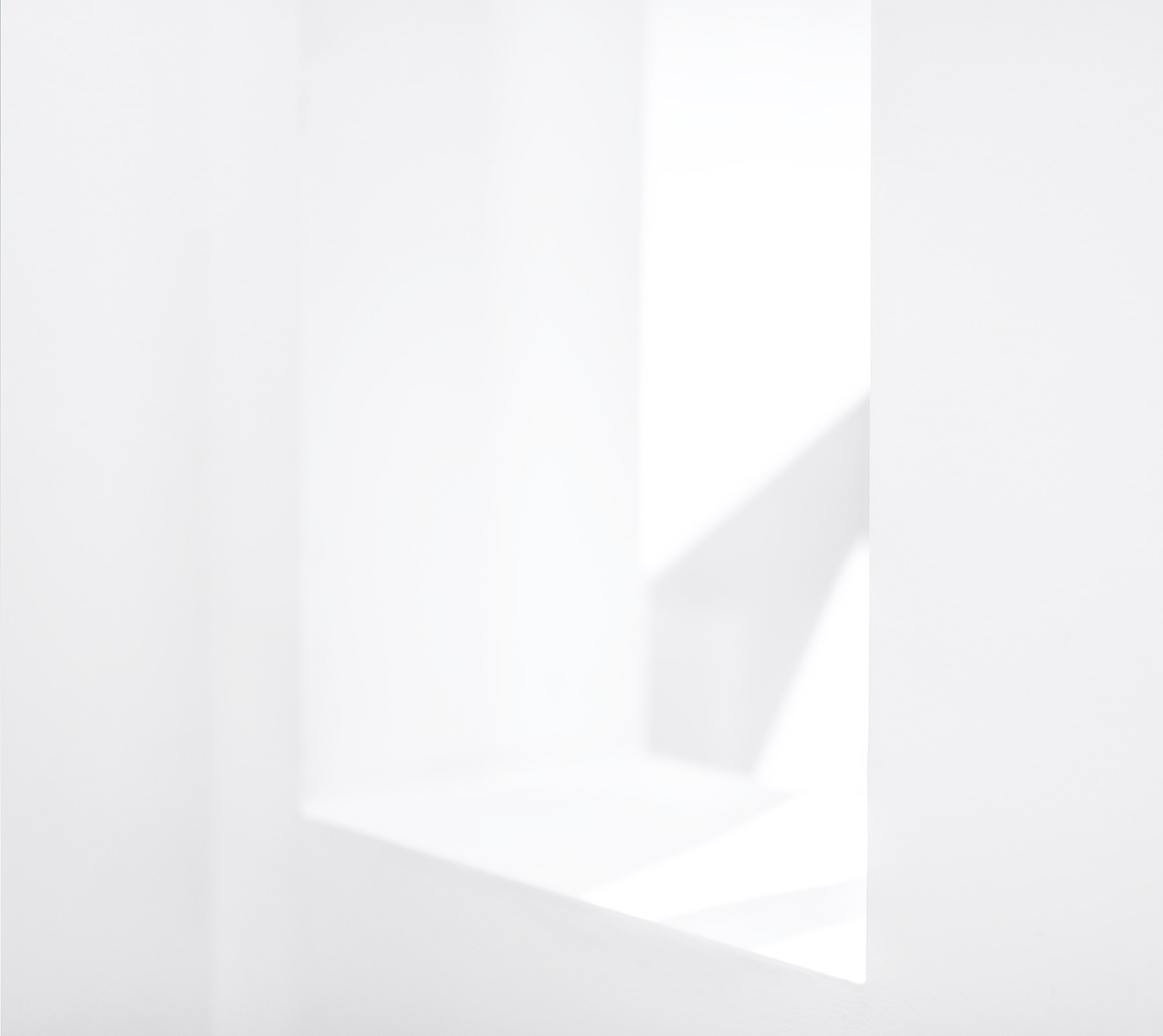 Abstract white interior with soft shadows.