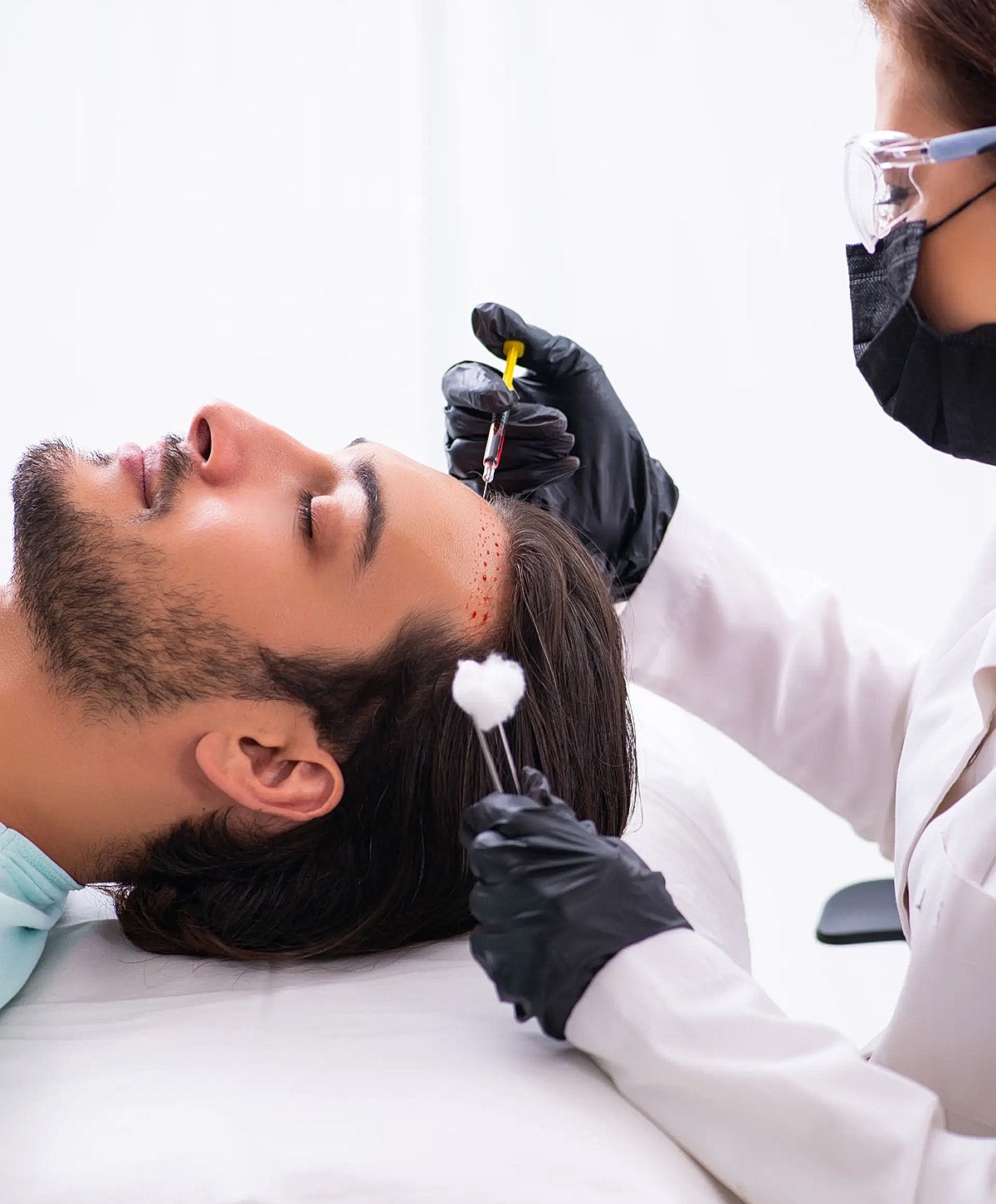 Medical professional performing cosmetic treatment on patient.