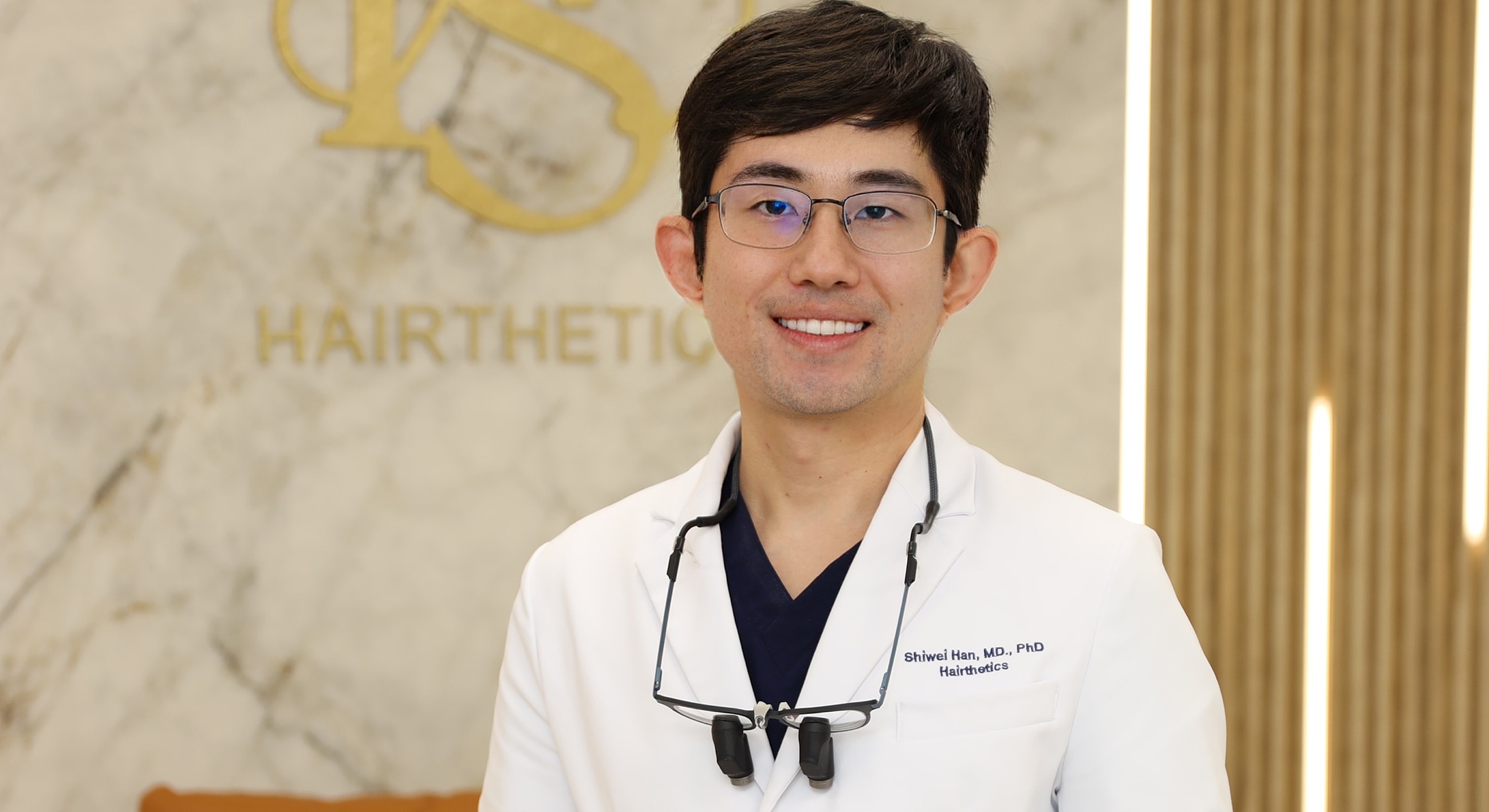 Doctor in white coat with hair clinic background.